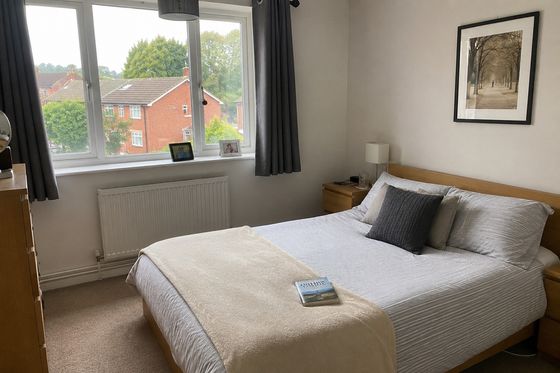 British spare bedroom with neutral walls before its conversion.